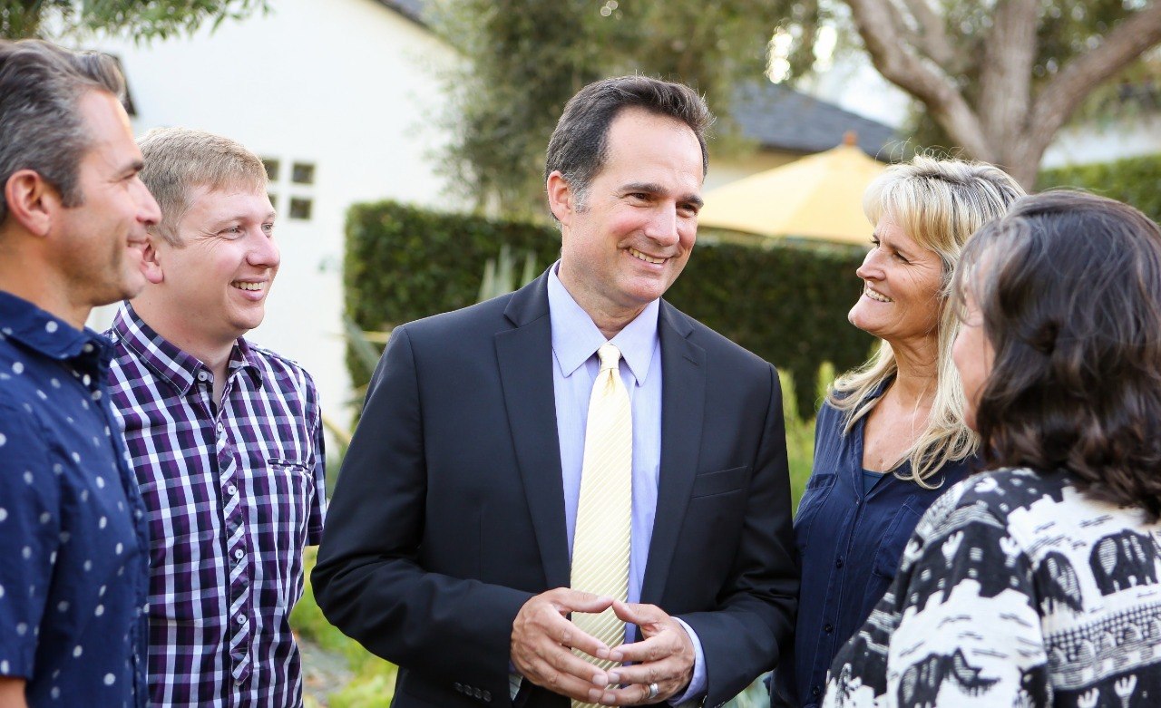 Jason Dominguez with community members in District 4